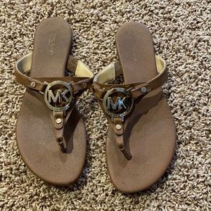Michael Kors Women’s sandals. Tan color with gold logo